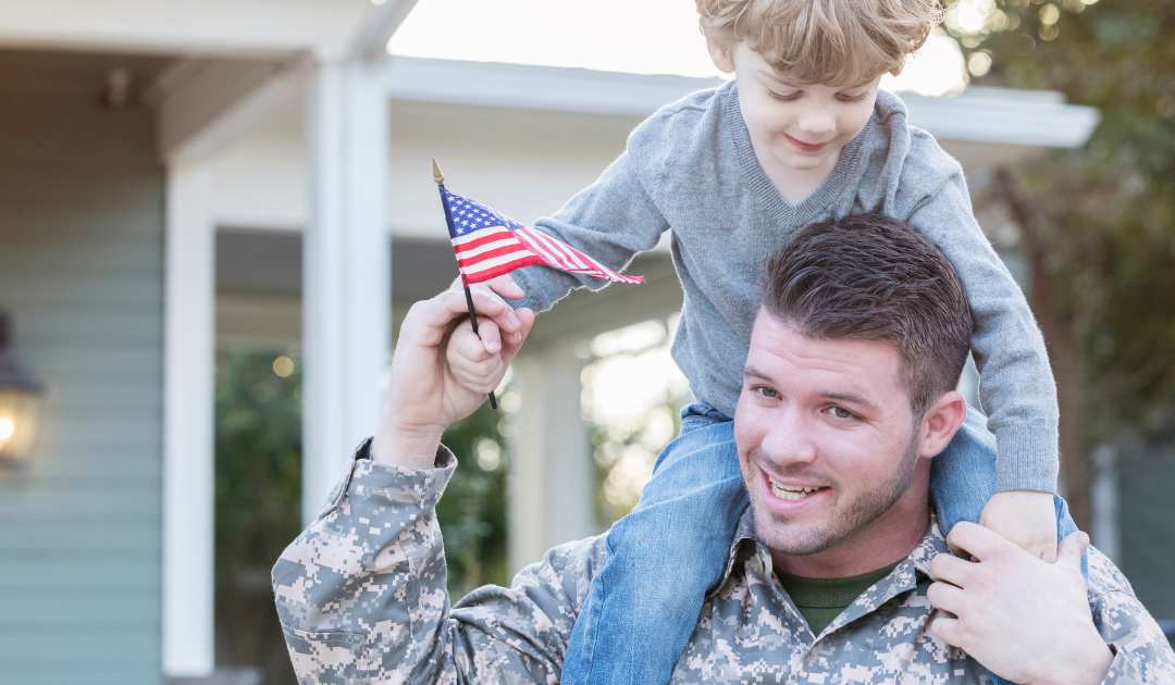 Military family outside their home in Hampton Roads while preparing for a PCS move and fast home sale